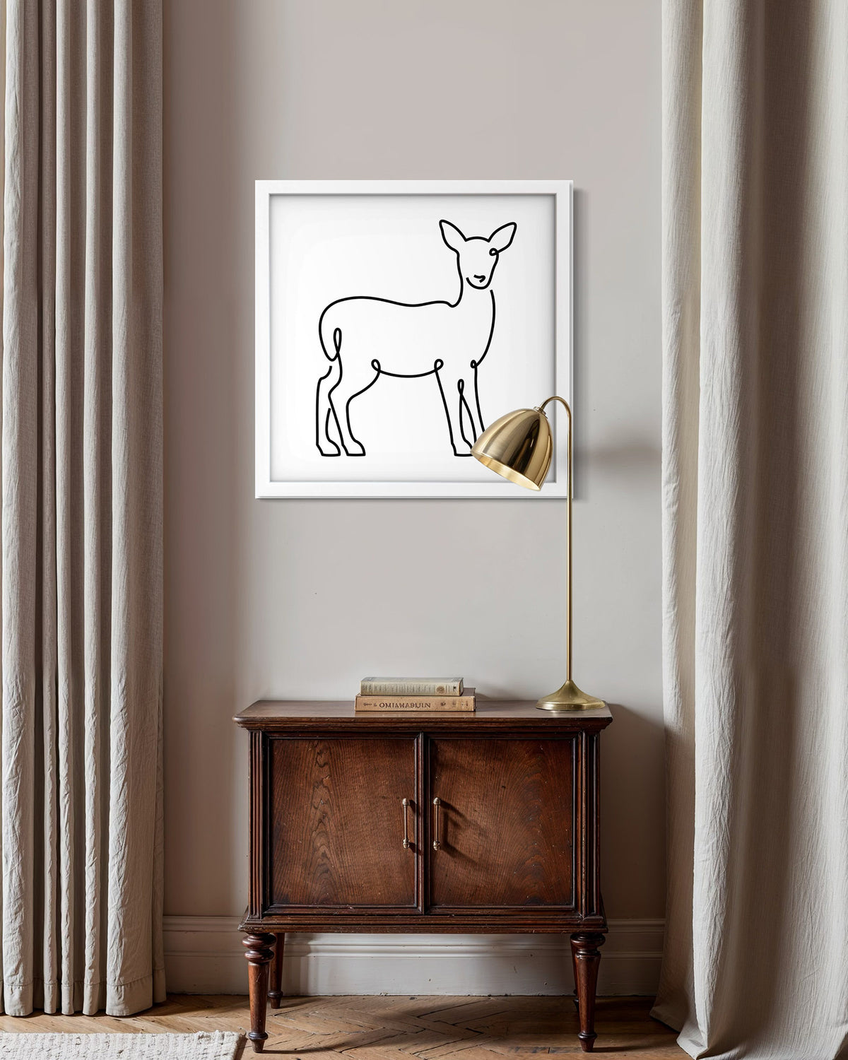 Deer framed art print displayed in a styled room setting